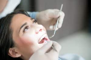 portrait of a woman at the dentist picture id819818190 300x200 1