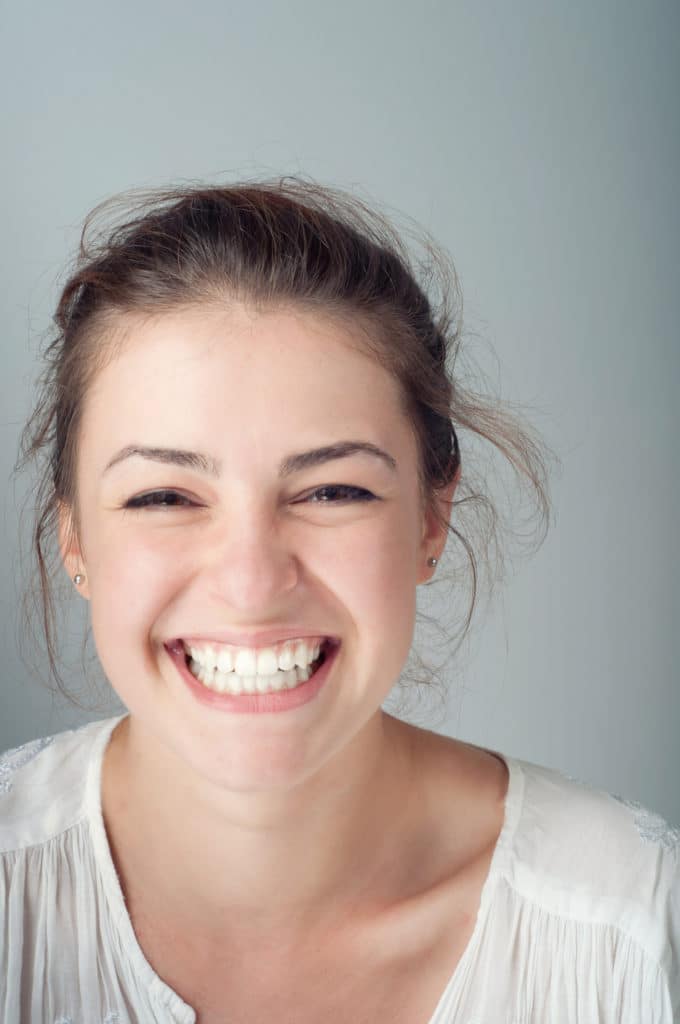 woman smiling after a smile makeover