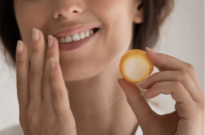woman hold moisturizing lip mask apply beauty product